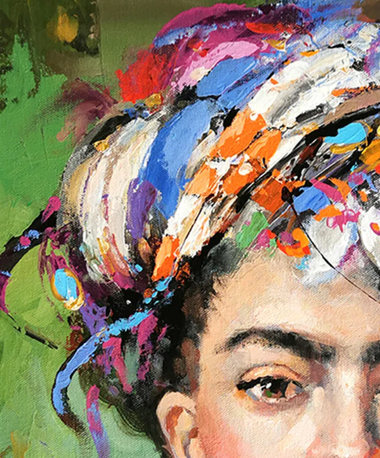 Detailed view of the vibrant headwrap featuring layered paint textures and expressive abstract colors.