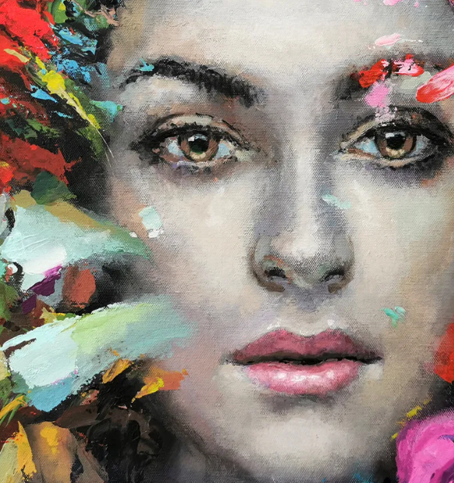 Close-up of colorful woman portrait painting with soft facial expression