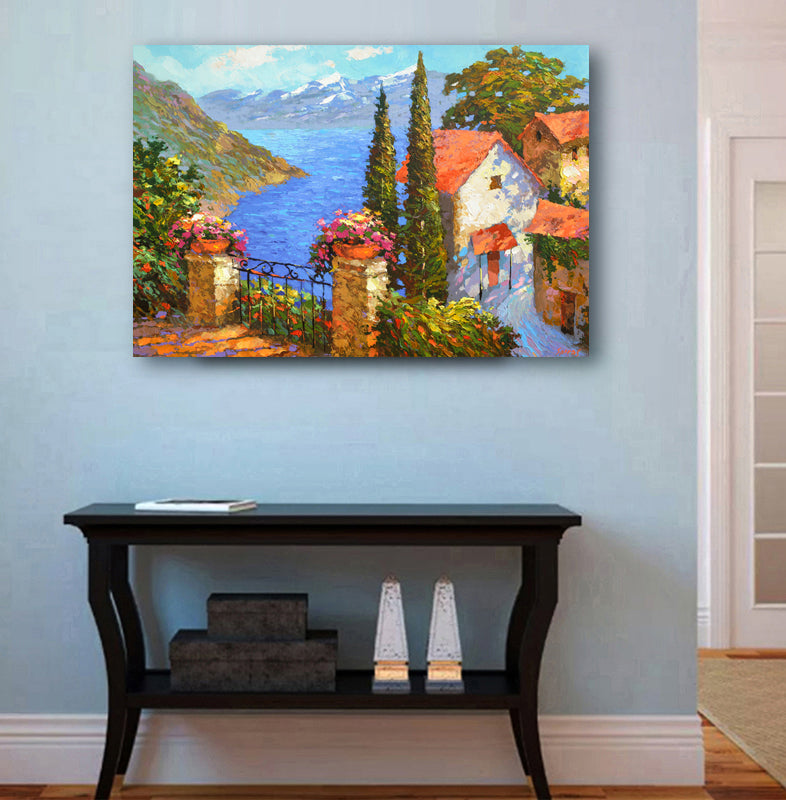 Coastal village seascape painting displayed in home interior